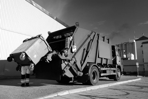 Workers removing demolition debris from a construction site in Kenton