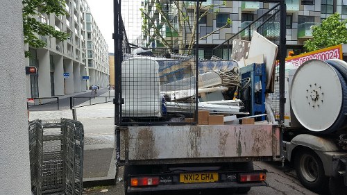 Workers sorting construction debris for recycling